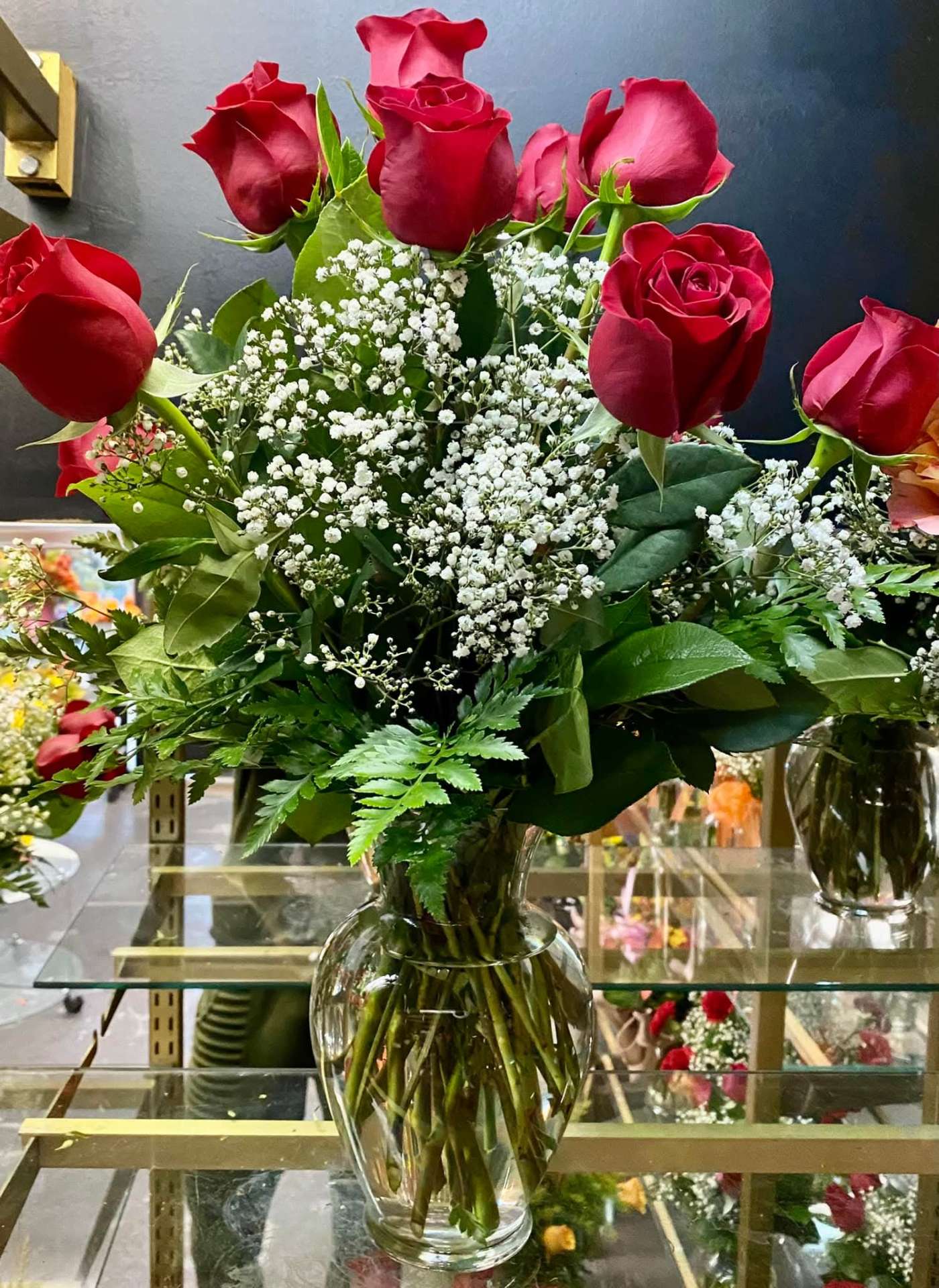 Dozen red roses arrangement with baby's breath