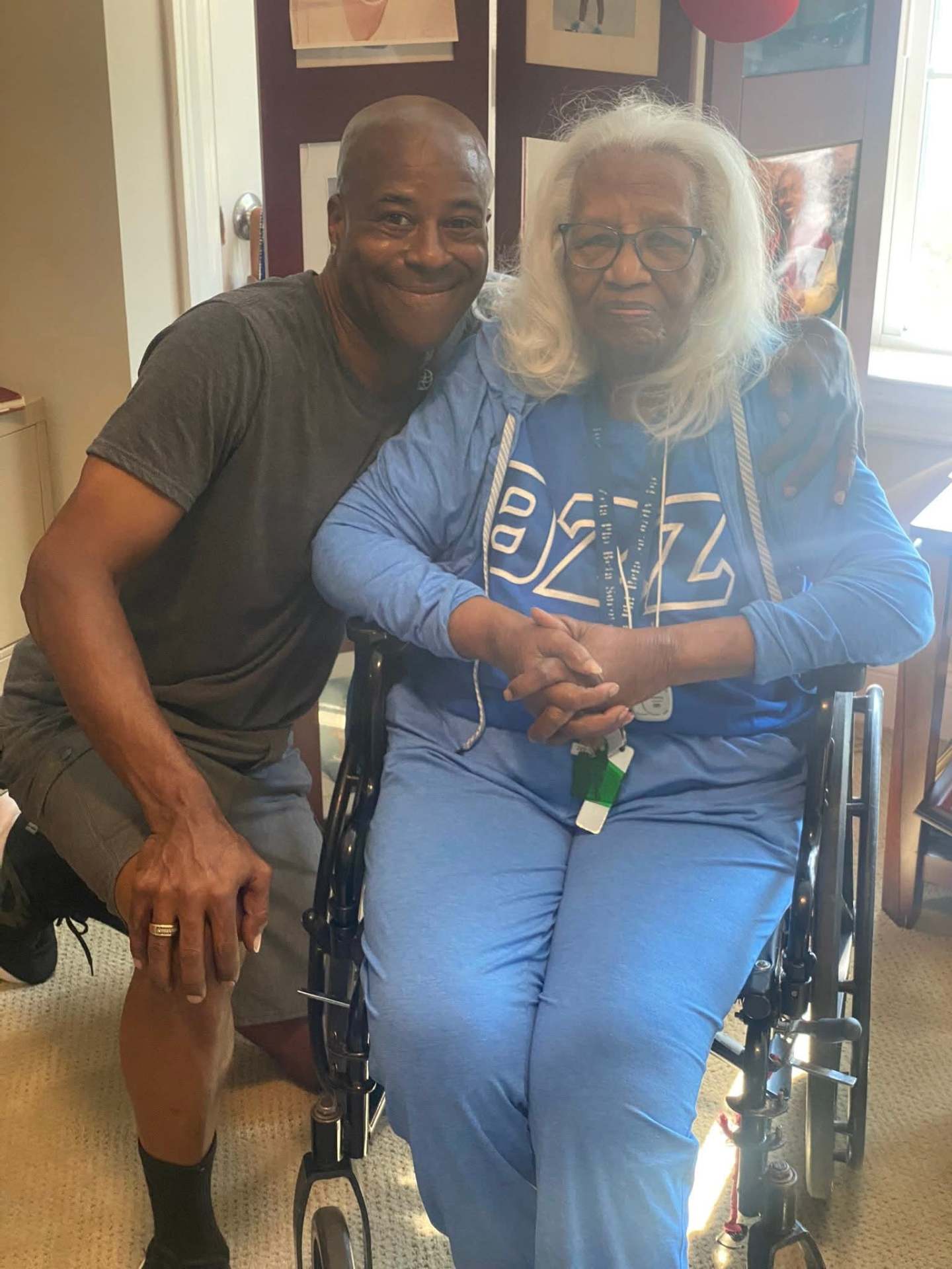 Owner with an elderly client in a wheelchair