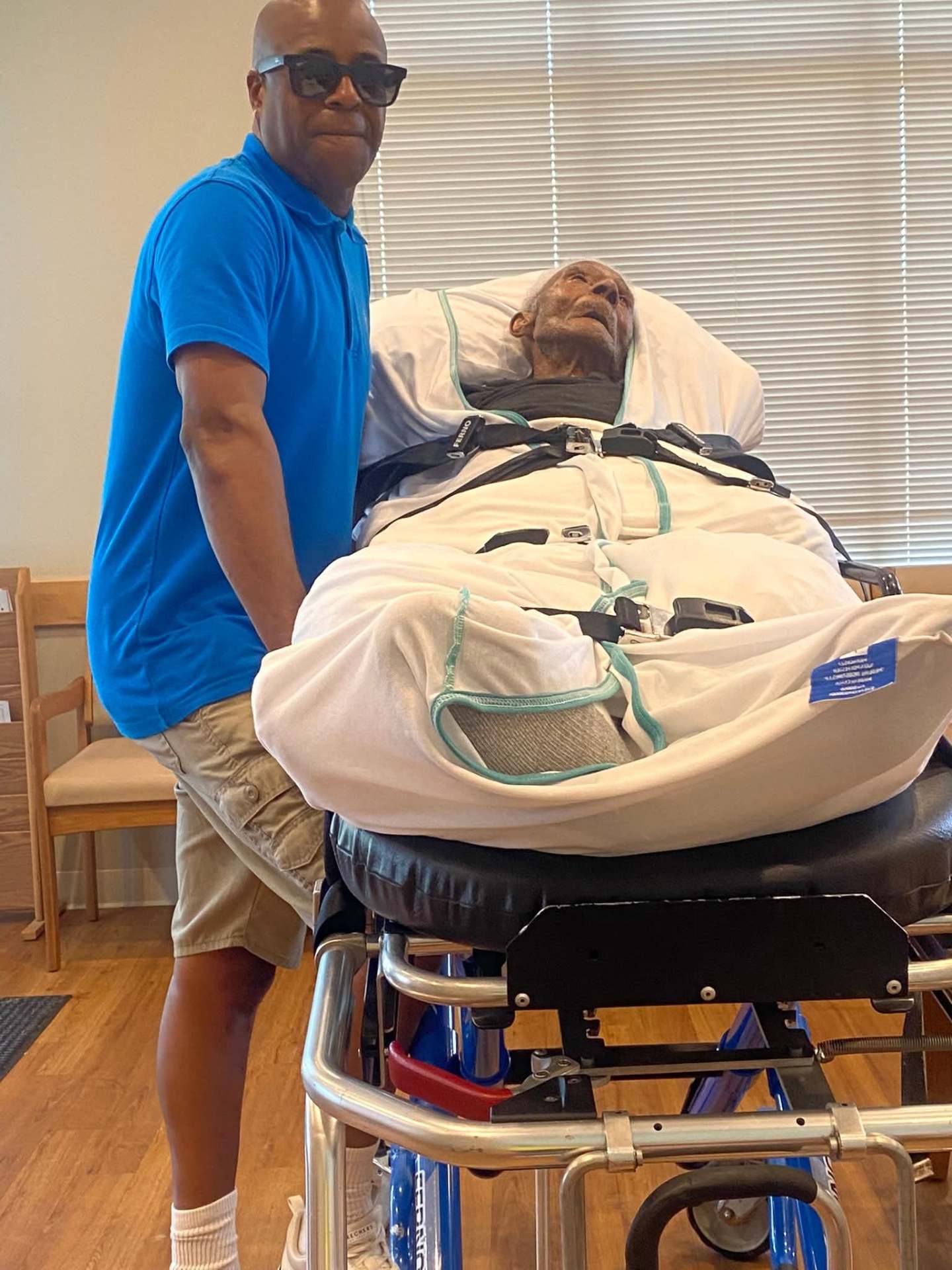 Owner safely transporting a client on a stretcher